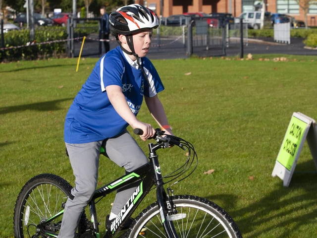 One of the young cyclists negotiates the terrain at the start of the cycle leg of Wednesday’s Primary Schools Duathlon at St. Mary’s College.