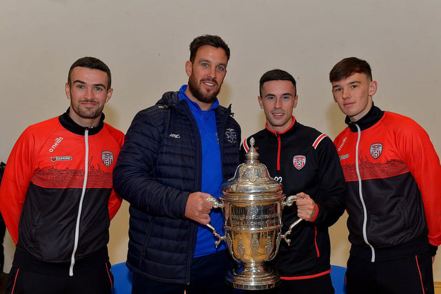 Derry City players Michael Duffy, Jordon McEneff and Liam Mullan, former pupils of St Columb's College, pictured with PE teacher Mark Scoltock  during a visit to the school with the FAI Cup, on Monday. Photo: George Sweeney. DER2247GS  33
