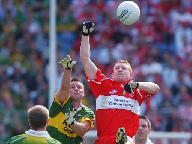 Derry midfielder Fergal Doherty takes to the Dublin skies against Kerry in 2004.