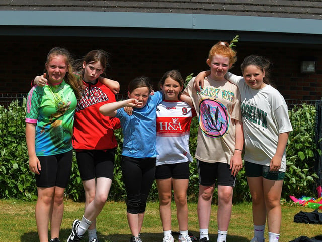 Friends enjoy the sunny weather and games at the Holy Child Primary School sports day held on Monday last. Photo: George Sweeney. DER2325GS – 010