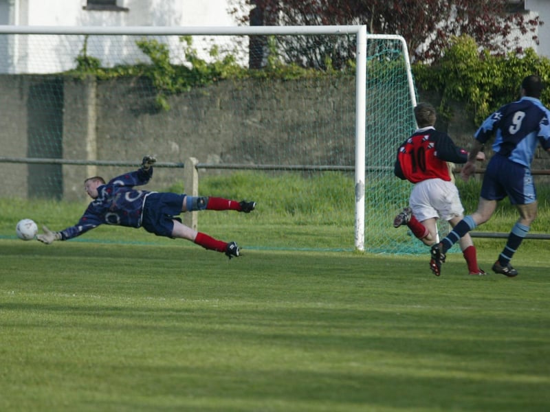 Carndonagh keeper Geard Crossan makes a great save from Illes captain Niall McDaid. (1305JB29)