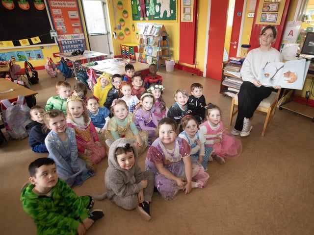 Happy Faces in Mrs. Harkin's P1 class at Hollybush as they are read a story during break on Thursday.