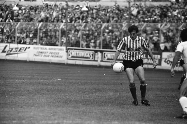 Alex Krstić in action against Benfica at the Brandywell in the European Cup in 1989 with a very large crowd looking on.