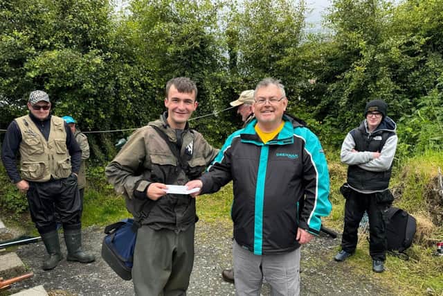 Gerry Quinn on the right presenting a prize to competition winner Danny Wade on Fathers Day. Danny won a season ticket to Cloghan Lodge on the River Finn during the James Quinn Memorial Competition.