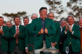 AUGUSTA, GEORGIA - APRIL 13: Rory McIlroy of Northern Ireland reacts as he puts on the Green Jacket during the ceremony after the 2025 Masters Tournament at Augusta National Golf Club on April 13, 2025 in Augusta, Georgia. (Photo by Michael Reaves/Getty Images)