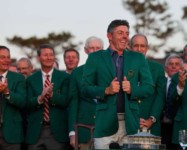 AUGUSTA, GEORGIA - APRIL 13: Rory McIlroy of Northern Ireland reacts as he puts on the Green Jacket during the ceremony after the 2025 Masters Tournament at Augusta National Golf Club on April 13, 2025 in Augusta, Georgia. (Photo by Michael Reaves/Getty Images)