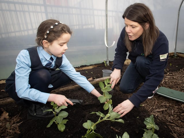 NWP's Sharon and pupil Cara pictured working in the polytunnel.