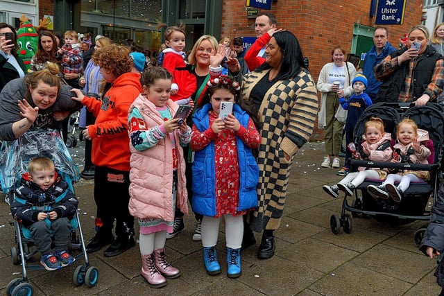 Children and parents gather at Foyleside Shopping Centre on Saturday morning to greet Santa. Photo: George Sweeney.  DER2244GS – 63