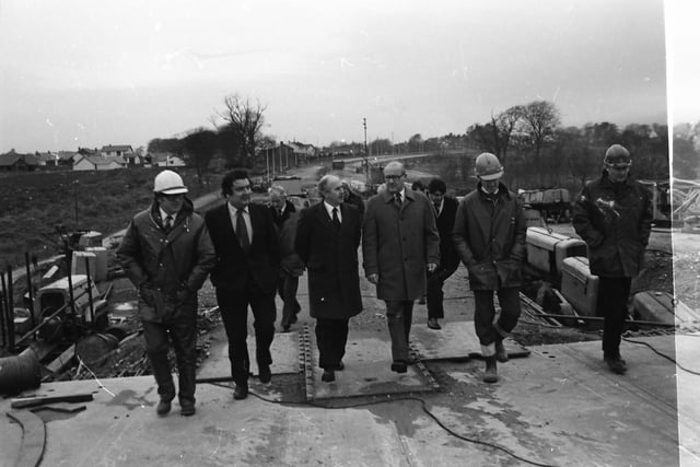 SDLP Leader John Hume with construction firm representatives and dignitaries during a visit by the European Commissioner for European Commissioner for Taxation, Consumer Affairs, Transport and Parliamentary Relations,  and Inter-institutional Relations and Administration, Richard Burke.