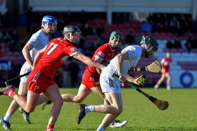 Derry’s Meehaul McGrath tackles Gerry Keegan of Kildare. Photo: George Sweeney