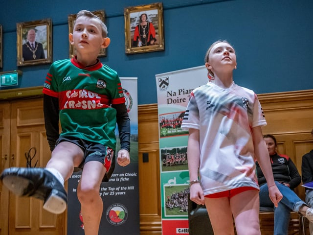 Doire Trasna GAC who are celebrating their 25th Anniversary received a commemorative crystal gift from the Mayor Councillor Ruairi McHugh in the Guildhall to mark their outstanding contribution to sport, community life and promotion of Gaelic games. During the evening the club’s traditional band and Irish dancers entertained guest with performances. Picture Martin McKeown. 22.01.26
