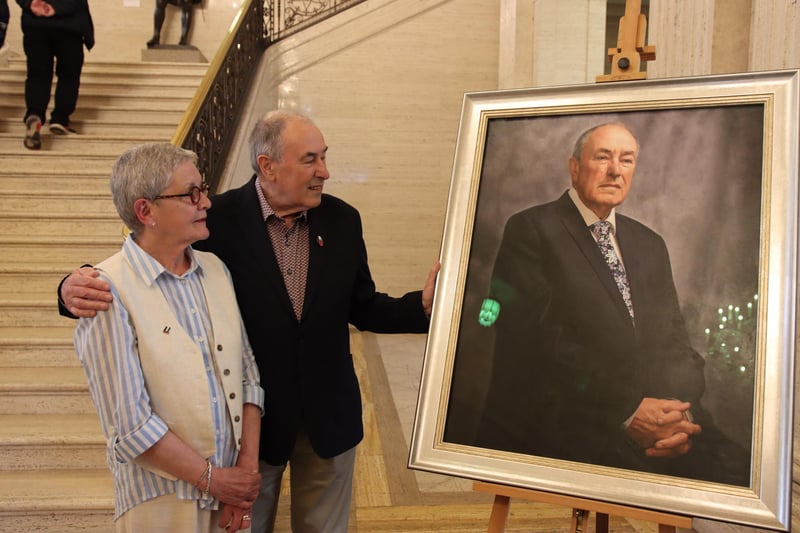 Mitchel McLaughlin and his wife Mary Lou viewing Catherine Creaney's portrait of the former Speaker at Stormont.