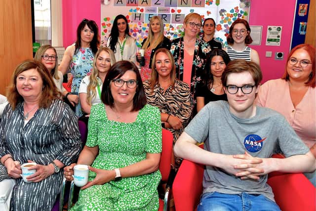 Volunteers and visitors at the Childline Foyle open day, held in the Derry office in June this year. Photo: George Sweeney. DER2321GS - 39