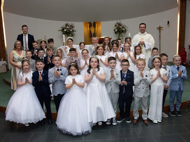 Children from Mr. McGivigan's class at Sacred Heart PS who received the Sacrament of First Holy Communion from Fr. Patrick Lagan at Sacred Heart Church on Saturday last. Included is Ms. Orlaith Owens, classroom assistant. (Photo: Jim McCafferty Photography)
