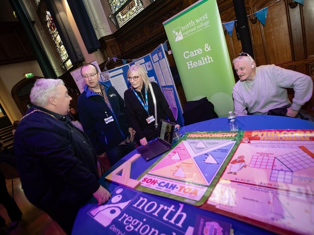 Deputy Mayor Darren Guy in conversation with some of the staff at the North West Regional College's stall on Saturday. : .