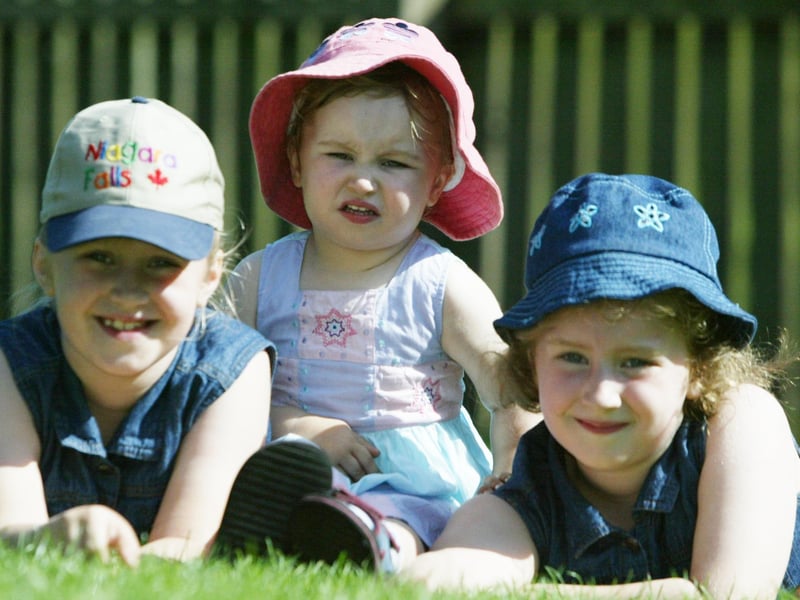 Sisters Sarah, Bethany and Rachel Smyth from Derry enjoying the sunshine at St. Columb's park yesterday afternoon. (0808JB98):Derry youngsters enjoying summer in August 2003