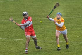 Antrim's Connor Dickson attempts to block a shot from Keelan Doherty of Derry. (Photo: George Sweeney)