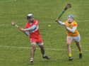 Antrim's Connor Dickson attempts to block a shot from Keelan Doherty of Derry. (Photo: George Sweeney)