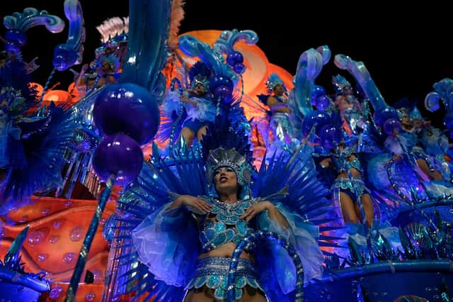 Members of the Unidos da Tijuca samba school perform during the first night of Rio's Carnival parade at the Sambadrome Marques de Sapucai in Rio de Janeiro on February 20, 2023. (Photo by MAURO PIMENTEL / MAURO PIMENTEL / AFP) (Photo by MAURO PIMENTEL/MAURO PIMENTEL/AFP via Getty Images)