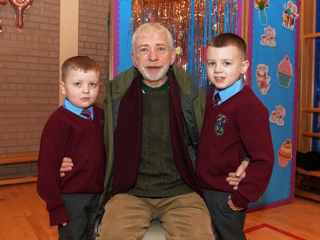 Robert Bradley with Josh and Jake at St John’s PS Grandparents Vintage Tea. Photo: George Sweeney
