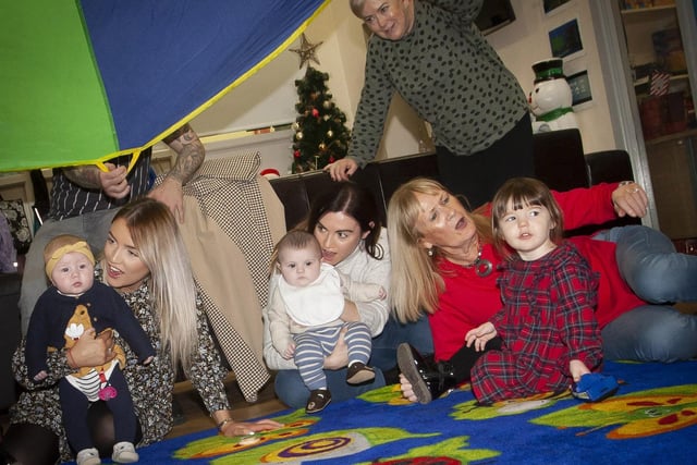 Parents, children, Gasyard Feile,and Surestart Edenballymore staff taking part in Friday’s fun activities at the Christmas Photos and Rhymetime Christmas Extravaganza at the Bishop Street Community Centre.