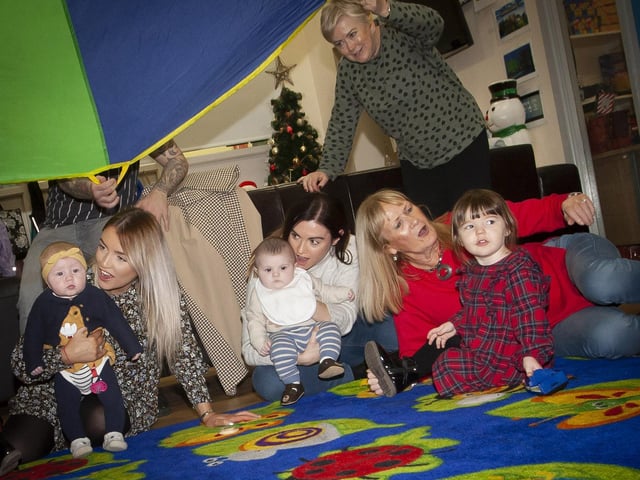 Parents, children, Gasyard Feile,and Surestart Edenballymore staff taking part in Friday’s fun activities at the Christmas Photos and Rhymetime Christmas Extravaganza at the Bishop Street Community Centre.