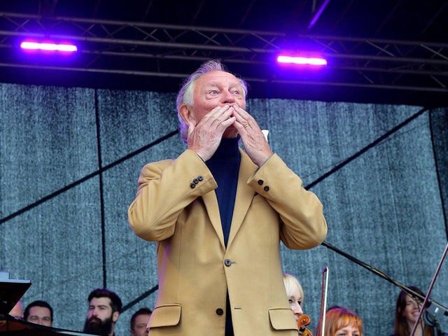 Phil Coutler greets the large attendance in Ebrington Square prior to the live performance of his iconic hit ‘The Town I Loved So Well’ on Saturday afternoon last. Photo: George Sweeney. DER2240GS – 09