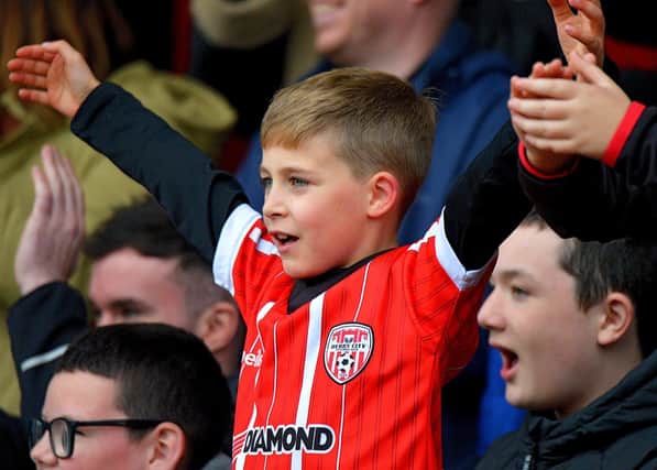 A young Derry City fans celebrates the candy stripes win over Treaty United in the FAI cup semi-final at Brandywell Stadium on Sunday afternoon last. Photo: George Sweeney.  DER2242GS – 022