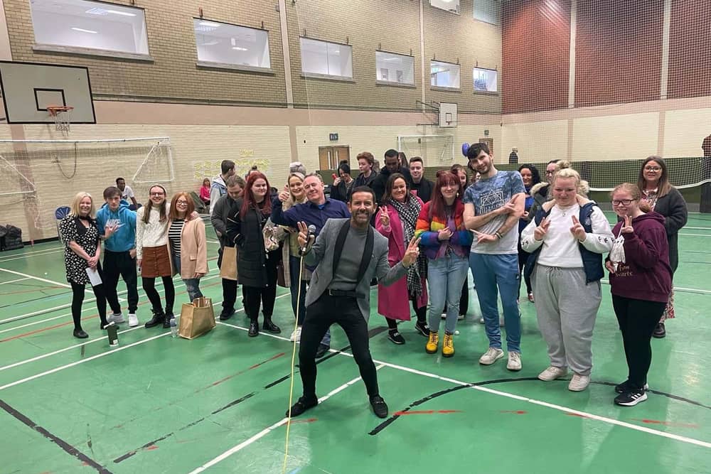 Derry star Micky Doherty with participants at the special event to recognise the achievements of young people in care.