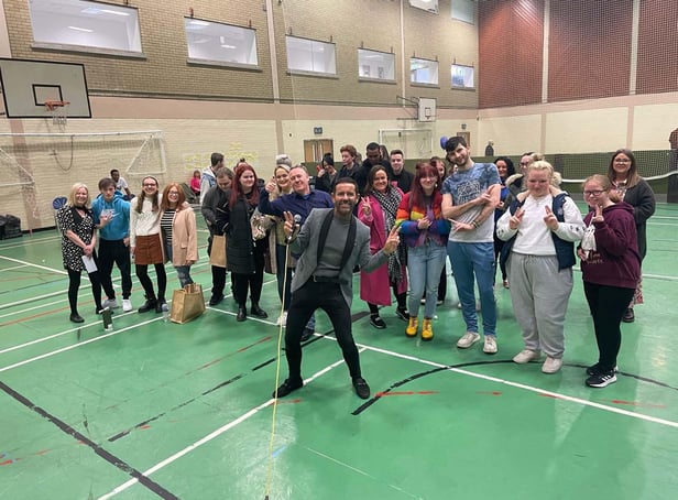Derry star Micky Doherty with participants at the special event to recognise the achievements of young people in care.