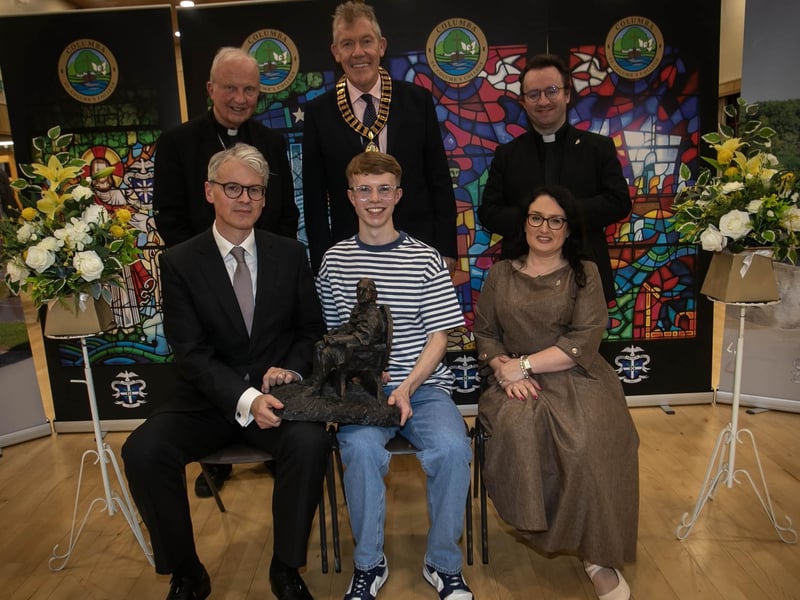 Mr Brendan McGurk KC (Guest Speaker and Past Pupil), presenting the Laureates' Prize and PPU Prize to Ben Crawley during Thursday's Senior Prizegiving. On left is Mrs Caroline McLaughlin (Principal). At back are Bishop Donal McKeown, Mr. Paul Brennan (Chair of the Past Pupil Union), and Fr Stephen Ward (School Chaplain). (Photos: Jim McCafferty Photography) : .