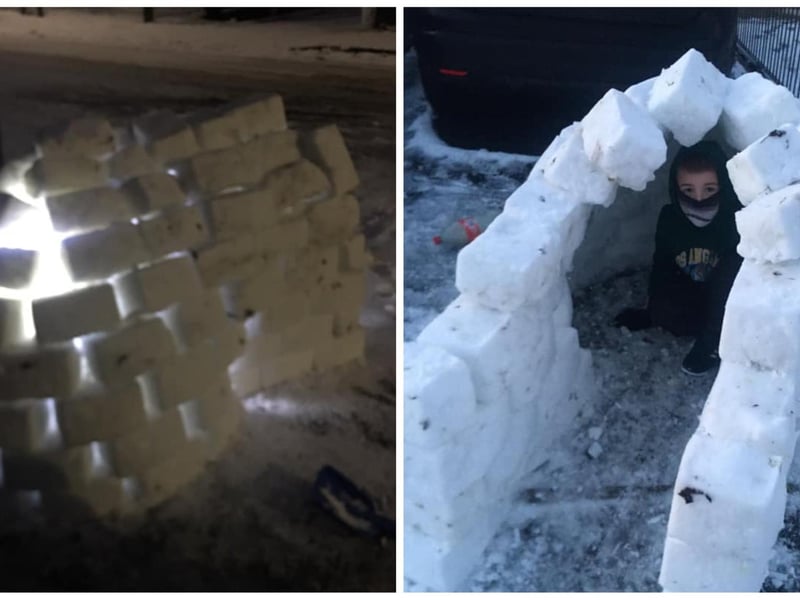Young brothers and their father created an igloo in Old School Lane. Photo: Georgie Cairns.