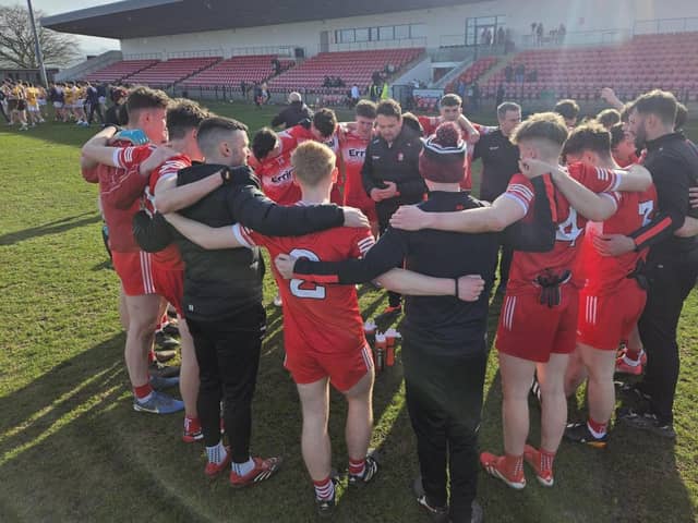 Derry minor manager Ciaran Glackin speaks to his players after Saturday's victory over Down.