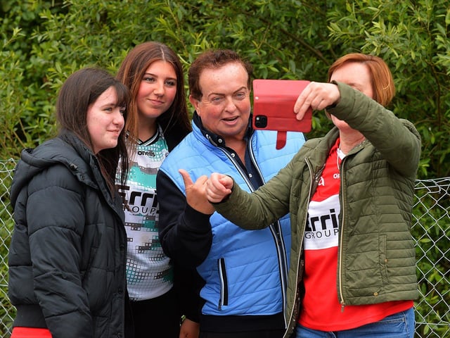 RTE’s Gaelic Games commentator, Martin Morrissey, poses for a selfie with Derry fans at Celtic Park. Photo: George Sweeney
