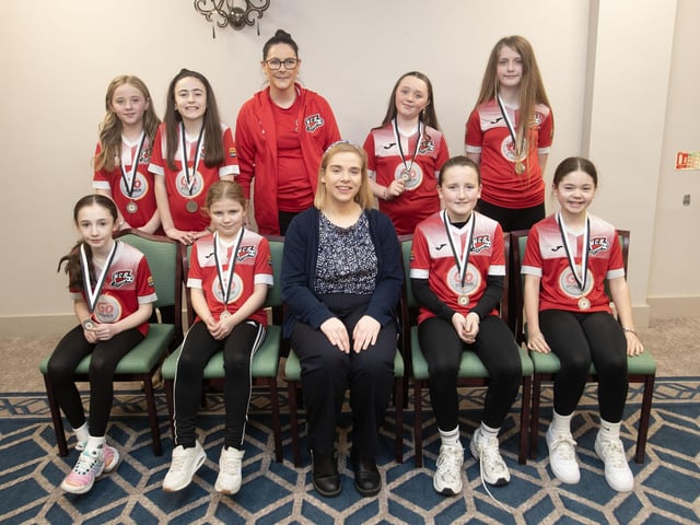 Maiden City u-11s, runners-up in the Summer Cup pictured with Kerri Pyne, Derry Credit Union, at the D&D Youth FA awards at the Waterfoot Hotel on Sunday night last. Included is coach Jennifer Browne. (Photos: Jim McCafferty Photography)