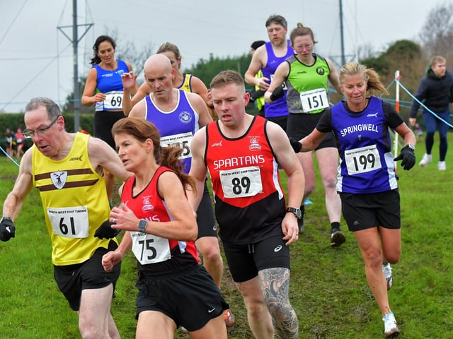 Spartans Catherine Hribar (75) and Diarmuid Keogh (89) competing in the Spartans open cross country 6k race at Thornhill College on Saturday. Photo: George Sweeney