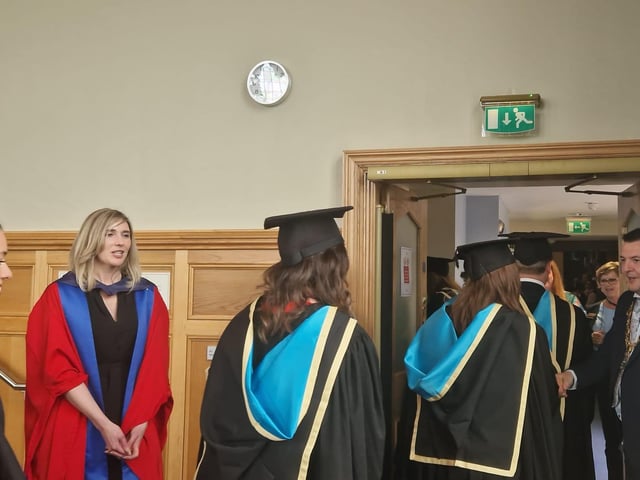 Graduates are congratulated by the Mayor of Derry & Strabane, Councillor Ruairí McHugh, as they make their way from the Council chamber to the Main Hall in the Guildhall to complete their graduation. Also pictured is Professor Patricia Harris, Course Director for Ulster University's Graduate Entry Medical