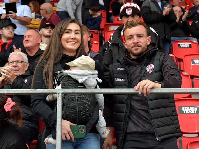 Derry City's newest signing Paul McMullan pictured with his partner Keavagh and son Patrick before the game gets underway between Derry City and Cork City on Friday evening. Photograph: George Sweeney. DER2325GS – 90