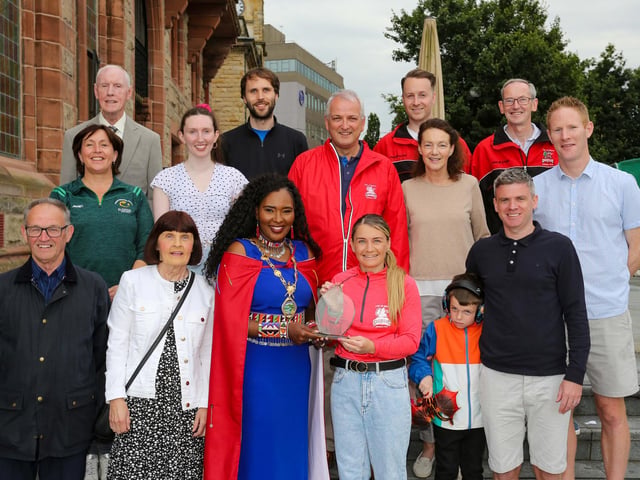 The Mayor of Derry Councillor Lilian Seenoi Barr presenting a civic gift to Gemma Thompson, City of Derry Spartans Athletic Club, at in reception in the Guildhall following her recent success in winning 2 medals at the European Masters Indoor Championships in Poland. Gemma won the medals in the 200m and 60m setting an Irish Record. Included are fellow members of City of Derry Spartans AC.Photo Lorcan Doherty