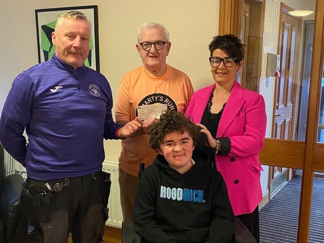 Tom Doherty, Martin Gallagher, Foyle Valley Athletics Club, presenting a cheque for £1,200, to Deborah O’Doherty and Niall O’Doherty, Action Duchenne. All monies going to research to help all children affected with muscular dystrophy. At present there is no cure.