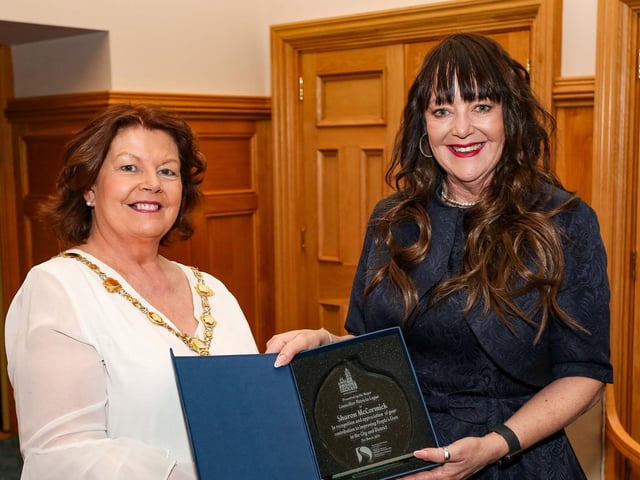 The Mayor of Derry, Councillor Patricia Logue, presenting a civic gift to Sharon McCormick at a reception in the Guildhall in appreciation of her contribution to improving peoples lives in the City and District.