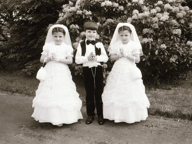 Triplets on their First Holy Communion.