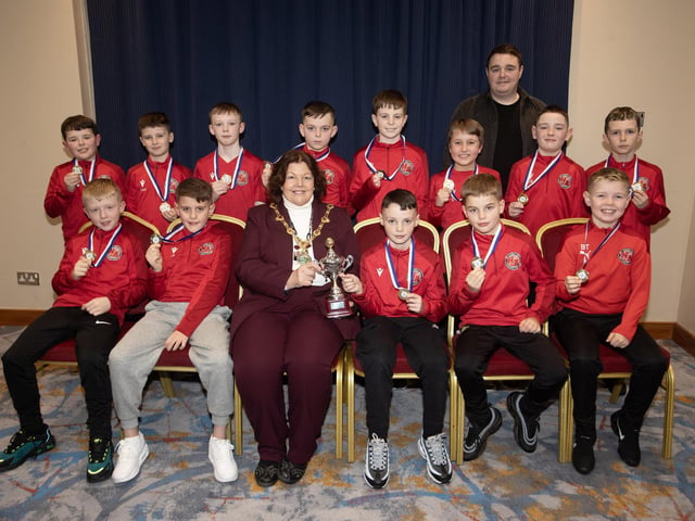 The Mayor of Derry City and Strabane District Council, Patricia Logue, pictured at the D&D Youth FA Annual Awards at the City Hotel on Friday night presents Newell Academy U10s with the Winter Cup. Included is coach Gavin Duffy. (Photos: Jim McCafferty Photography)