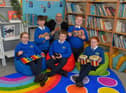 Eamonn McCarron, from Project Sparks, pictured with P7 pupils Aoibhe, Valan, James, Cillian and Eabha with some of the musical instruments donated to St Paul’s Primary School, Slievemore on Tuesday last. Photo: George Sweeney. DER2310GS – 009