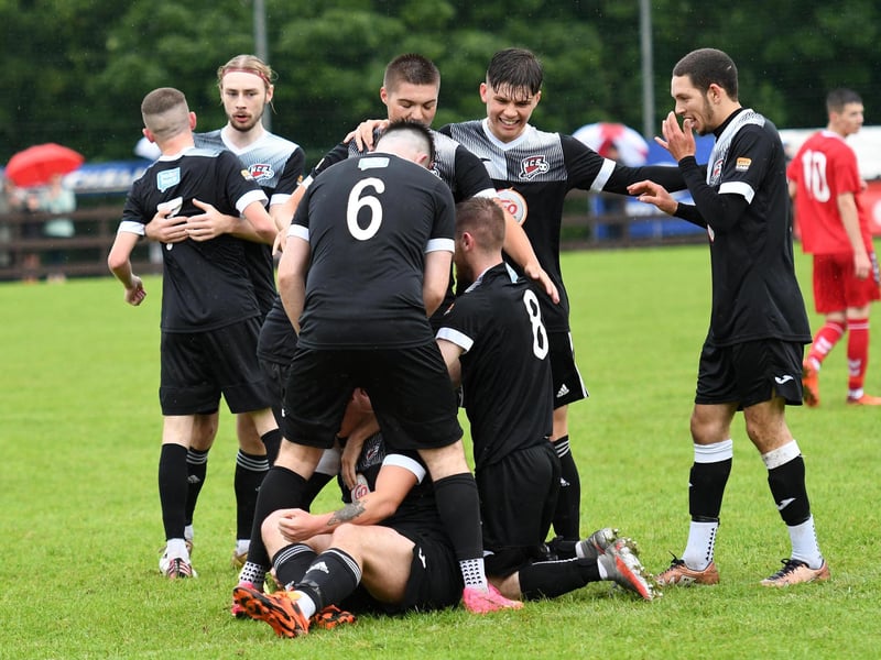 Maiden City's Ben Smith is mobbed by his team-mates after their goal against Carndonagh during the O'Neills Foyle Cup Under-19's final at Ardmore.