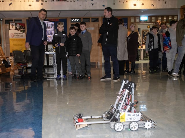 Enjoying the workings of one of the robots at St. Joseph's during Open Night.
