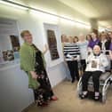 Artist Maureen McGhee pictured with staff and patrons of Old Library Trust DEEDS during the unveiling of her beautiful new artwork at the North West Cancer Centre in Altnagelvin Area Hospital on Friday morning last.