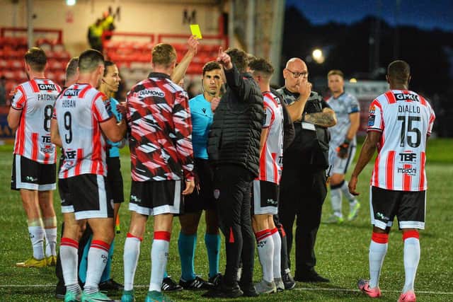 Derry City players crowd around referee Antoine Paul Chiaramonti at the end of the game against FCB Magpies.Photograph: George Sweeney