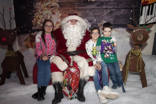 Croise, Sophie and Oisin letting Santa know they are leaving him out milk and cookies on Christmas Eve, during his visit to the FDST Christmas Party this week. (Photos: Jim McCafferty Photography)