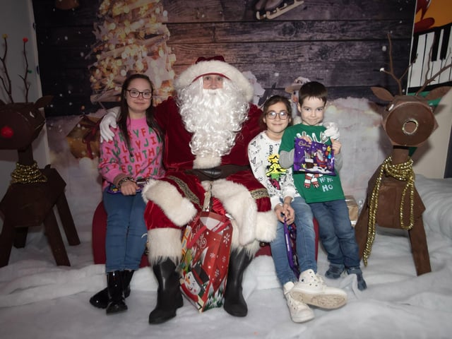 Croise, Sophie and Oisin letting Santa know they are leaving him out milk and cookies on Christmas Eve, during his visit to the FDST Christmas Party this week. (Photos: Jim McCafferty Photography)